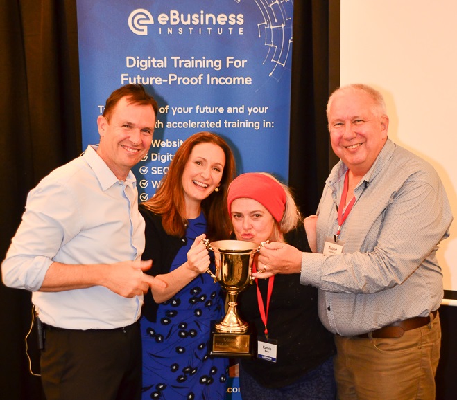 Kath and Rob Rushford accepting student of the year award off Matt and Liz Raad eBusiness Institute