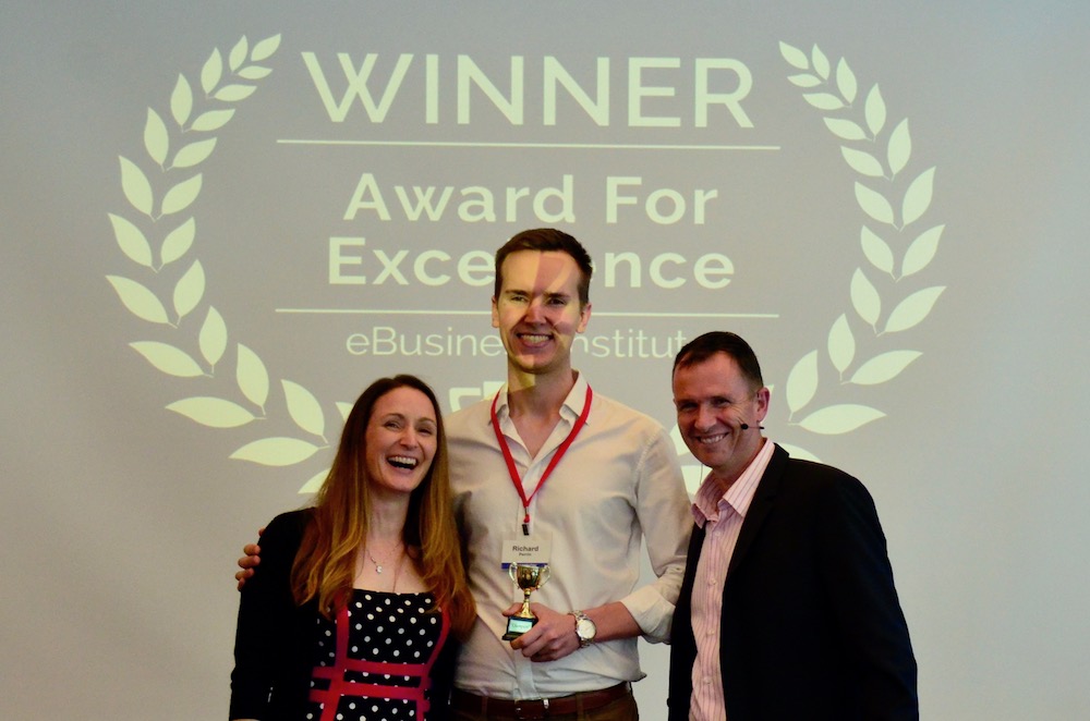 Richard Perrin winning digital marketing award from Matt Raad and Liz Raad